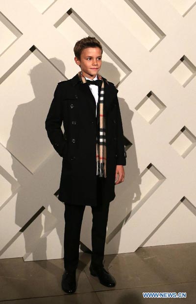 Like father like son: Romeo Beckham attends Burberry campaign