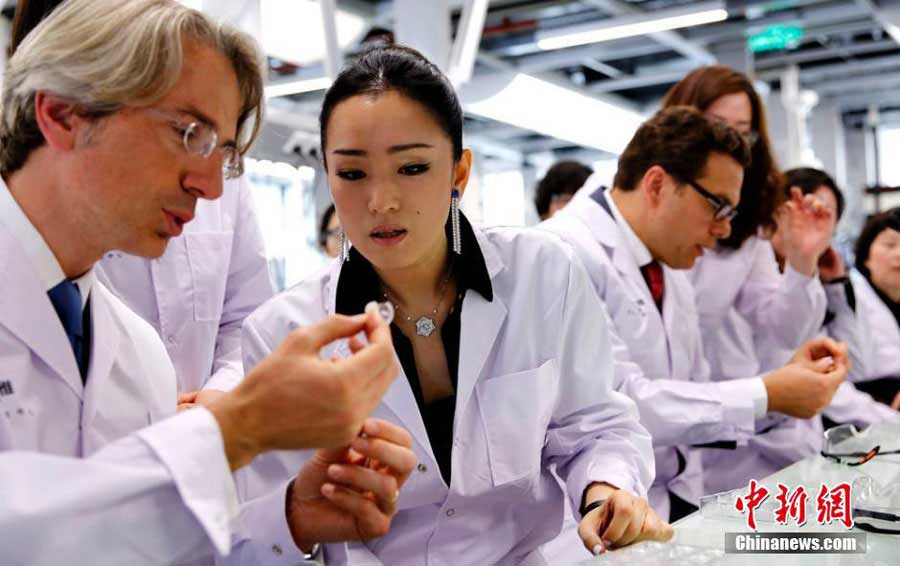 Gong Li visits L'oreal research center in Shang