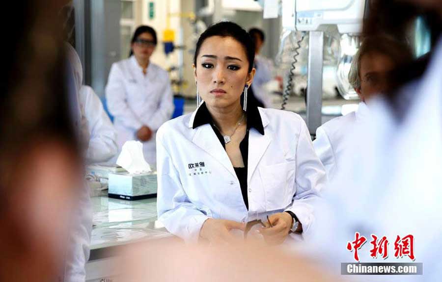 Gong Li visits L'oreal research center in Shanghai