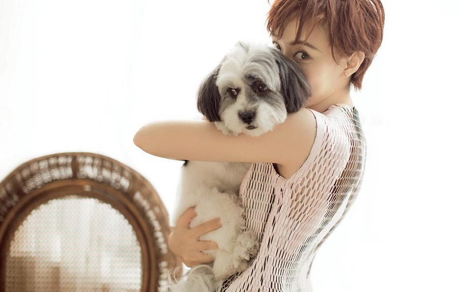 Sun Li poses with dogs for fashion magazine