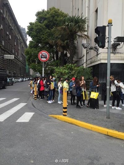 Fans line up in Shanghai to pose with postbox touched by pop star