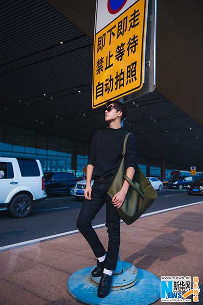 Actor Jing Boran poses in all-black