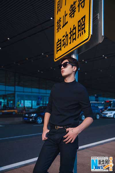 Actor Jing Boran poses in all-black