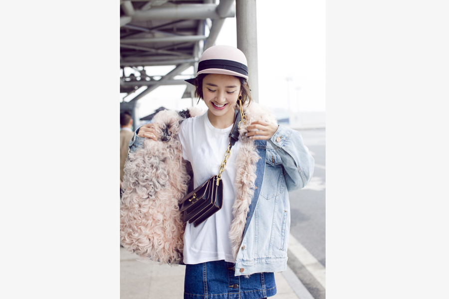 Actress Tang Yixin poses for street style photos