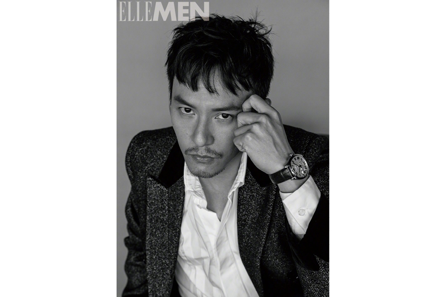 Actor Zhang Zhen poses for the fashion magazine