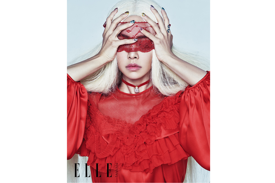 White and red: Jolin Tsai poses for fashion magazine