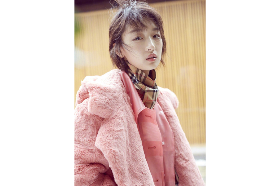 Actress Zhou Dongyu poses for fashion magazine