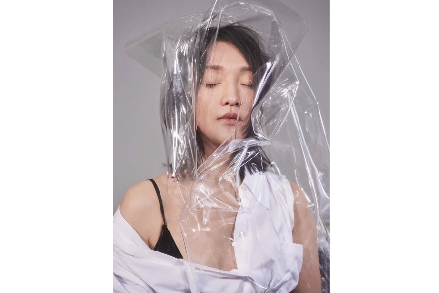 Actress Zhou Xun poses for fashion magazine