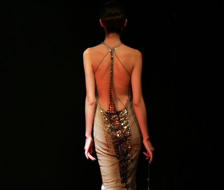 A model presents a creation for Italy's Gattinoni high fashion show at the 14th China International Fashion Week in Beijing March 30, 2006. [Reuters]