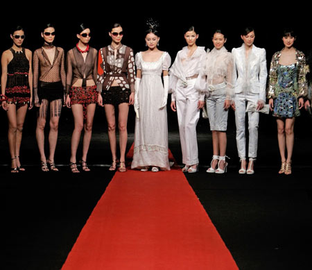 A model presents a creation for Italy's Gattinoni high fashion show at the 14th China International Fashion Week in Beijing March 30, 2006. [Reuters]