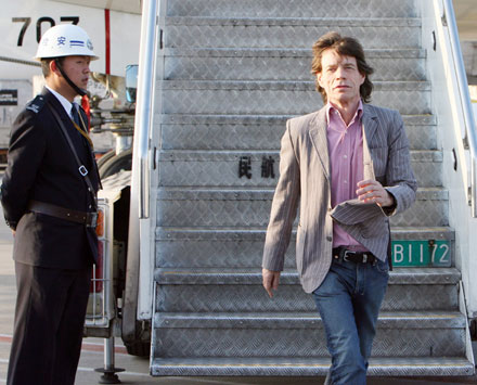Mick Jagger of the Rolling Stones arrives at the Pudong international airport in Shanghai, China, April 6, 2006. The band arrived in Shanghai on Thursday afternoon in preparation for a concert on Saturday, their third attempt to play in China.