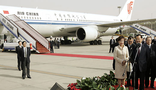 Lien Chan (R), honorary chairman of Taiwan's main opposition Nationalist Party, speaks to reporters after arriving at China's Beijing International Airport April 13, 2006. 