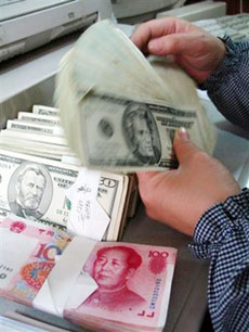 A bank clerk exchanges Chinese yuan for an equivalent amount of U.S. dollars in a bank in Liaocheng, east China's Shandong province, February 28, 2006. China should gradually reduce its holdings of U.S. debt and can stop buying dollar-denominated bonds, a Hong Kong newspaper on Tuesday quoted Cheng Siwei, a vice chief of China's parliament, as saying.