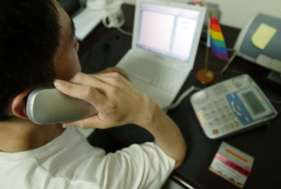 A volunteer answers a call to the hotline for gays in Shanghai May 11, 2006. The hotline, 800-988-1929, has offices in Shanghai as well as Guangzhou in south China's Guangdong Province. Hotline volunteers, all gays, will help their comrades on questions as AIDS, psychological and legal issues. The aim of this hotline is "gays helping gays." [newsphoto]