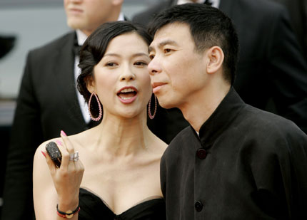 Chinese actress Zhang Ziyi (L) and Chinese director Feng Xiaogang arrive for the screening for Mexican director Alejandro Gonzalez Inarritu's in competition film 'Babel' at the 59th Cannes Film Festival May 23, 2006.