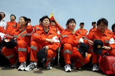 Members of the Chinese International Search and Rescue team gather prior to boarding an Air China plane departing for Yogyakarta in Beijing May 29, 2006. Countries and aid agencies from around the world have pledged tens of millions of dollars for the survivors of an earthquake on Indonesia's Java island that has killed 5,136 people. China is offering $2 million as well as rescue personnel and supplies. [Reuters]