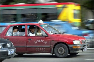 A Beijing taxi. Fuel-efficient cars with low emissions proved popular in China's auto market in the first half of this year, accounting for half of the top-10 best selling vehicles(AFP/