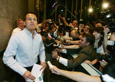 PCCW Ltd. chairman Richard Li speaks to the media after a board meeting in Hong Kong, July 10, 2006. Li said on Monday that his Singapore-listed Pacific Century Regional Developments was selling its 23 percent stake in PCCW for HK$6.00 a share to local financier Francis Leung.
