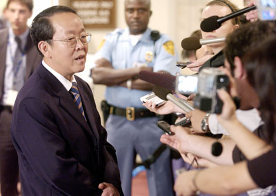 Chinese Ambassador to the UN Wang Guangya speaks after a meeting of the UN Security Council at the United Nations in New York, July 10, 2006. 