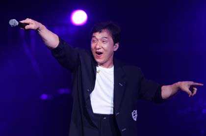 Hong Kong actor Jackie Chan performs as a guest singer during Taiwanese pop musician Jonathan Lee's concert in Hong Kong in this July 9, 2006 file photo. Local media reports on July 11, 2006 said an apparently drunk Chan had disrupted Lee's concert the previous night.