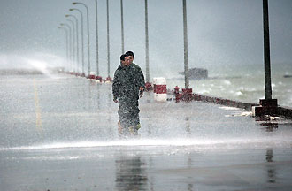 Soldiers patrol dykes shortly before Typhoon Kaemi makes a landfall at Jinjiang in East China's Fujian Province.