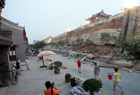 Renovators of the ancient city walls in Xi'an are in for a busy time after a 30-metre section they were working on partly collapsed on Tuesday.
