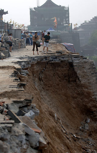 Renovators of the ancient city walls in Xi'an are in for a busy time after a 30-metre section they were working on partly collapsed on Tuesday.