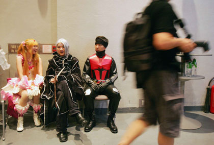 A girl dressed up as a character from a Japan's comic "Angel Sanctuary" poses during the Cosplay competition in Ani-com Hong Kong, an animation and comic fair in Hong Kong, July 28, 2006. Cosplay, made up of the words "costume" and "play", is a Japanese subculture which involves dressing as characters from manga (comic), anime and video games. [Reuters]