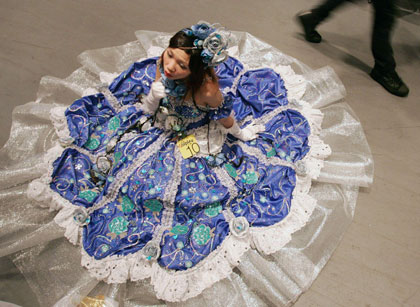 A girl dressed up as a character from Japan's comic "Paradise Kiss" rests on the floor during the Cosplay competition in Ani-com Hong Kong, an animation and comic fair in Hong Kong, July 28, 2006. Cosplay, made up of the words "costume" and "play", is a Japanese subculture which involves dressing as characters from manga (comic), anime and video games.