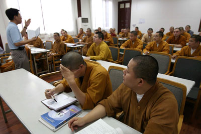 Chinese Buddhist monks attend secular classes as part of preparations for college entry exams in Yufo monastery in Shanghai August 9, 2006. Piety and a knowledge of Buddhist scriptures used to qualify one to be a Chinese monk. Now, add computer skills, foreign language ability and a degree in financial management. [Reuters]