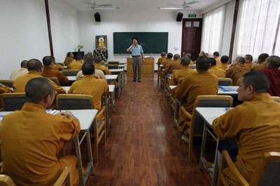 Chinese Buddhist monks attend secular classes as part of preparations for college entry exams in Yufo monastery in Shanghai August 9, 2006. Piety and a knowledge of Buddhist scriptures used to qualify one to be a Chinese monk. Now, add computer skills, foreign language ability and a degree in financial management. [Reuters]