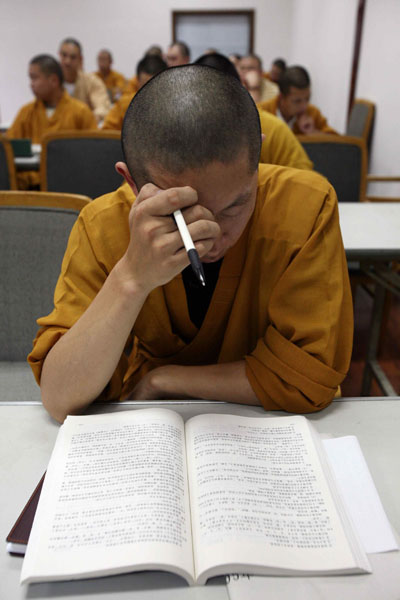Chinese Buddhist monks attend secular classes as part of preparations for college entry exams in Yufo monastery in Shanghai August 9, 2006. Piety and a knowledge of Buddhist scriptures used to qualify one to be a Chinese monk. Now, add computer skills, foreign language ability and a degree in financial management. [Reuters]