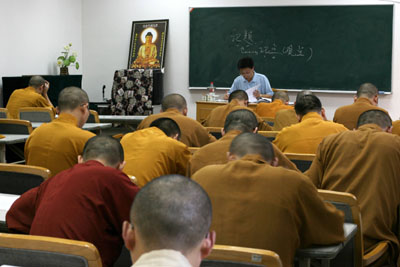 Chinese Buddhist monks attend secular classes as part of preparations for college entry exams in Yufo monastery in Shanghai August 9, 2006. Piety and a knowledge of Buddhist scriptures used to qualify one to be a Chinese monk. Now, add computer skills, foreign language ability and a degree in financial management. [Reuters]