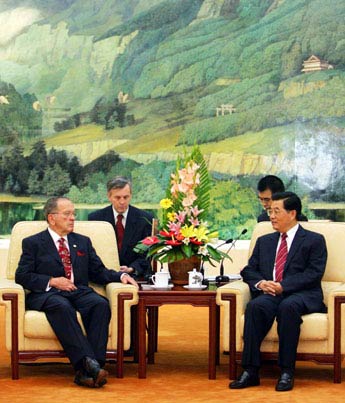 Chinese President Hu Jintao (R) speaks with Alaska Senator Ted Stevens during their meeting at the Great Hall of the People in Beijing August 12, 2006. 