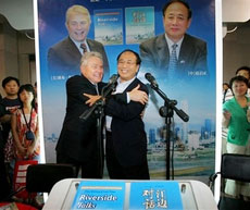 Former spokesman for Communist China's Cabinet and atheist Zhao Qizheng, right, embraces American evangelist and preacher Luis Palau at a signing for their book titled 'Riverside Talks: A Friendly Dialogue Between an Atheist and a Christian.' at a bookfair in Beijing, China Wednesday Aug. 30, 2006. The 140-page work is in part a public relations exercise. Palau wants to reach out to Chinese curious about religion, while Zhao is hoping to give the West a better understanding of China's culture and beliefs. Their different agendas also illustrate the complex picture of religion in China today: Religions, Christianity included, are thriving as Chinese search for answers amid tumultuous economic and social changes, but the government is struggling to maintain control through restrictive religious policies. (AP