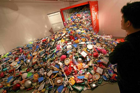 A visitor looks at a piece of work by Chinese artist Liu Jianhua during the opening of the 6th Shanghai Biennial in Shanghai September 5, 2006. 