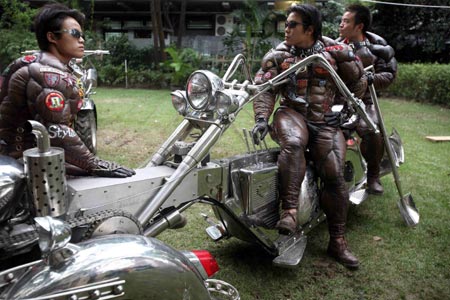 Models pose at art work of Chinese artist Shi Jinsong titled "Halong-Kellong" during the opening of the 6th Shanghai Biennial in Shanghai September 5, 2006.