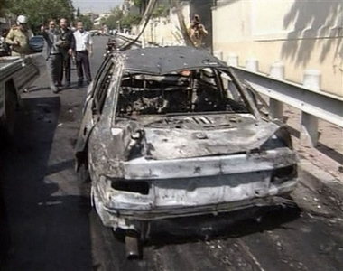  burnt out car is seen near the US embassy in Damascus, Tuesday, Sept. 12, 2006, in this image made from television. Syrian security forces killed three attackers, the government said, after gunmen apparently blew up a car outside the U.S. Embassy and exchanged fire with Syrian guards on Tuesday in a bold attack on Damascus' diplomatic neighborhood. The Interior Ministry, which is in charge of police, said a fourth attacker was wounded in the incident, which it called a 'terrorist attack.' The report, carried on state-run television, said an investigation was under way. In Washington, a U.S. State Department spokesman confirmed the attack on the American embassy by 'unknown assailants' and said the event appears to be over. A Syrian who works at the U.S. Embassy said there were no American casualties. 