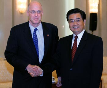 U.S. Treasury Secretary Henry Paulson (L) shakes hands with China's President Hu Jintao during their meeting at the Great Hall of the People in Beijing September 22, 2006. Washington and Beijing differ on the timing of resolving their economic disagreements, but not on the general goals, U.S. Treasury Secretary Henry Paulson said on Friday after meeting China's top two leaders.