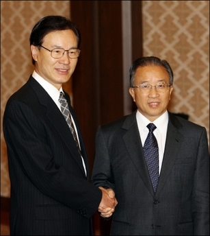 Chinese Executive Vice Foreign Minister Dai Bingguo (R) is welcomed by his Japanese counterpart Shotaro Yachi (L) prior to their meeting at the Foreign Ministry's Iikura guesthouse in Tokyo. Japan and China began vice-ministerial level talks just a few days ahead of Japan's new administration, in a bid to seek ways to ease strained ties between the two Asian powers.[AFP]