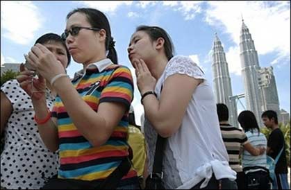 Chinese tourists visit Kuala Lumpur. With orders to speak quietly, respect queues and put litter in bins, China has released a list of 