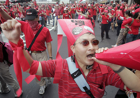Protesters gesture during a demonstration calling for the resignation of Taiwan's President Chen Shui-bian, outside Taipei train station in Taipei October 10, 2006. 