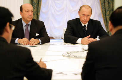 Russian President Vladimir Putin (2nd R) and Security Council Secretary Igor Ivanov (2nd L) speak to China's top envoy on North Korea Tang Jiaxuan (R) in Moscow's Kremlin October 14, 2006.