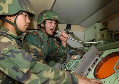 Chinese soldiers take part in a war exercise under the code name 