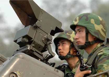 Chinese soldiers take part in a war exercise under the code name 
