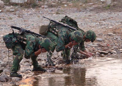 Chinese soldiers take part in a war exercise under the code name 