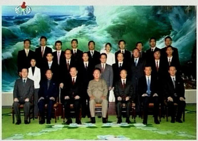 China's State Councillor and former Foreign Minister Tang Jiaxuan (3rd L, front row) poses with North Korean leader Kim Jong-il (4th R, front row) in Pyongyang, North Korea, in this video grab released on October 19, 2006. The United States said on Thursday it was open to negotiations with North Korea over its nuclear ambitions as attention focused on whether China had managed to persuade the North to defuse the mounting crisis. 