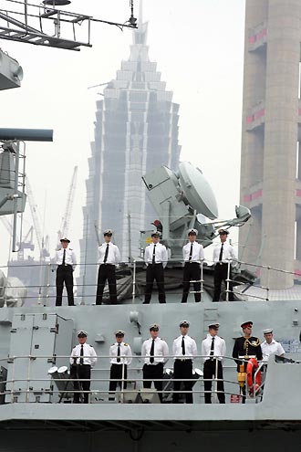 Pearl of a ship: HMS Westminster of the UK Navy, led by Rear Admiral Neil Morisetti, visits Shanghai yesterday. Altogether 181 sailors are participating in the five-day visit. [Xinhua]