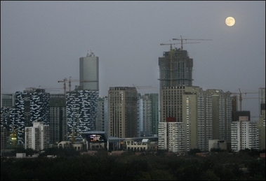 The moon over Beijing. The World Bank expects China's economy to grow by 10.4 percent this year and cool to 9.6 percent in 2007, but has warned that such fast paced growth was exacerbating structural imbalances(AFP