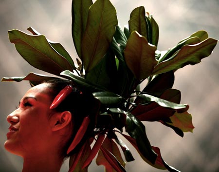 A model shows off a hairstyle made with leaves and capsicums during a hairdressing contest in Hangzhou, east China's Zhejiang province October 11, 2006. 